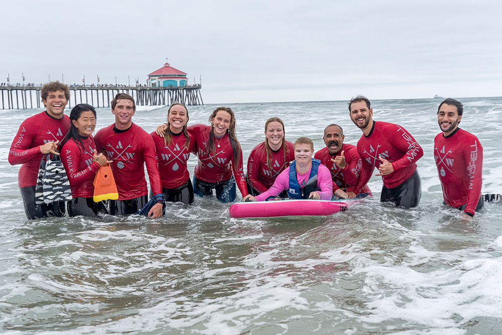 Group shot of A Walk on Water participants in the water smiling