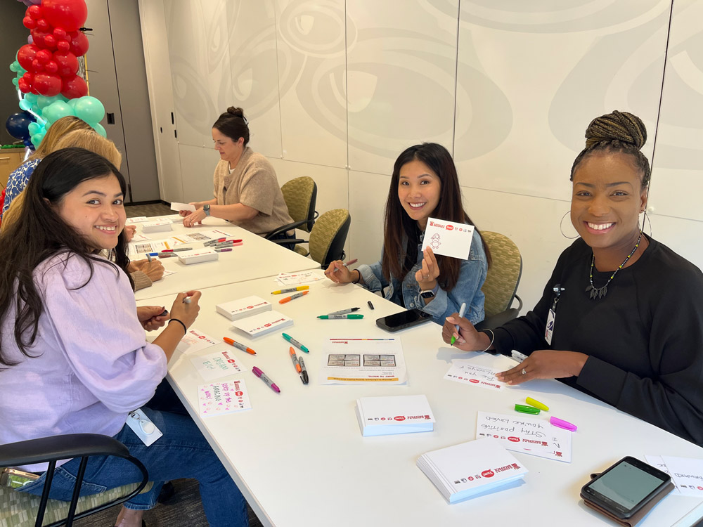 volunteers at a table for 'Blessings in a Backpack'