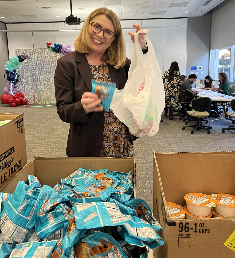 smiling volunteer for 'Blessings in a Backpack'