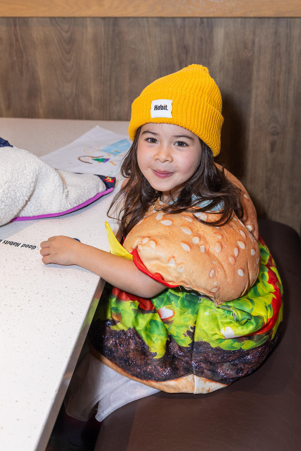 Young girl in a burger costume at Good Habits Day 