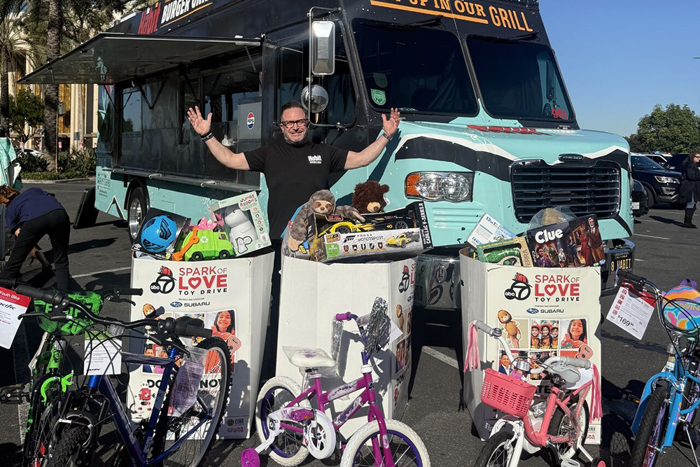 Chef Jason Triail with toy bins and the Habit Truck