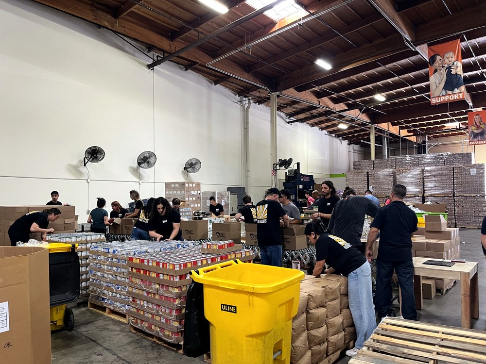 Habit Team takes donations and packs them for distribution at the OC Food Bank