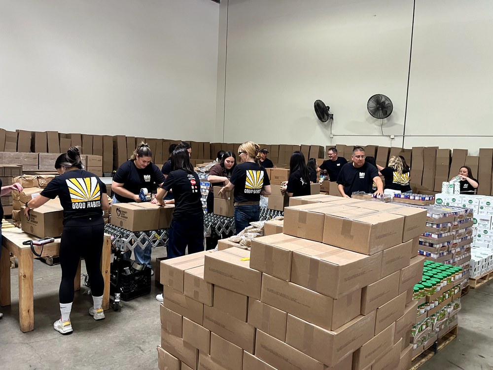 Habit Team Packing and Stacking Donations at the OC Food Bank