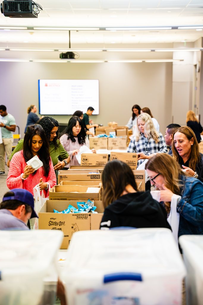 Volunteers packing weekend meal bags for local students at the Blessings in a Backpack event