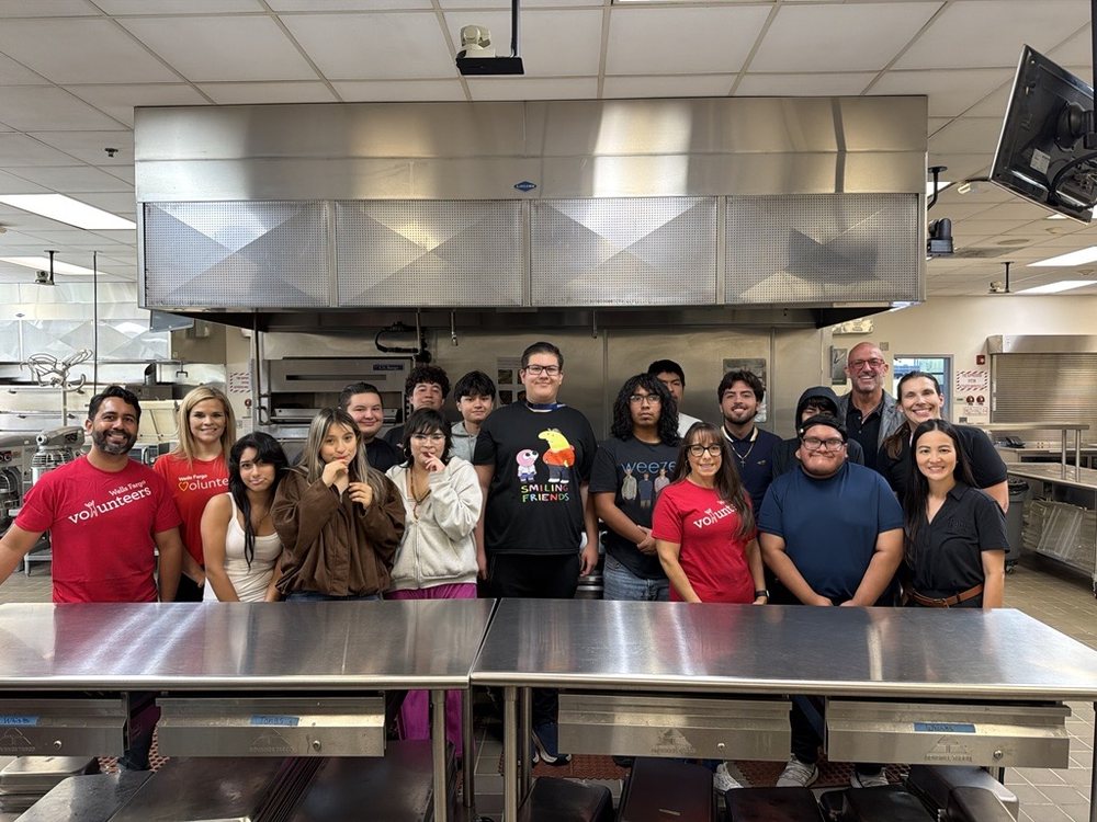 Habit volunteers and students in a high school culinary classroom at FIT Day 2026